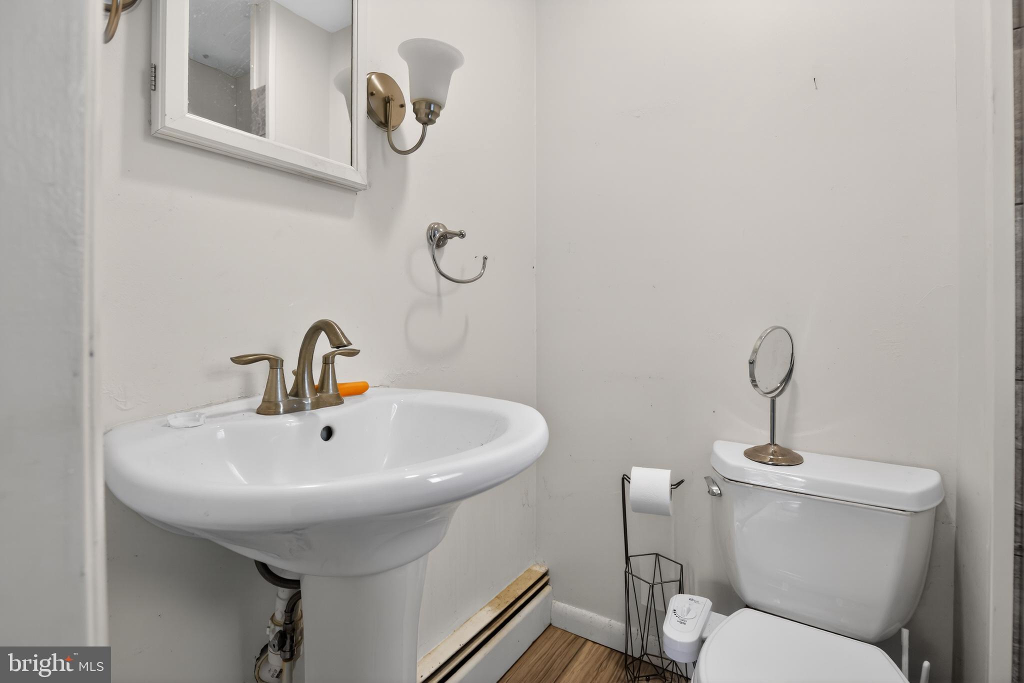 4144 Fox Trail Road Havre de Grace, MD 21078 - Photo 32 of 44 a bathroom with a sink a mirror and a toilet