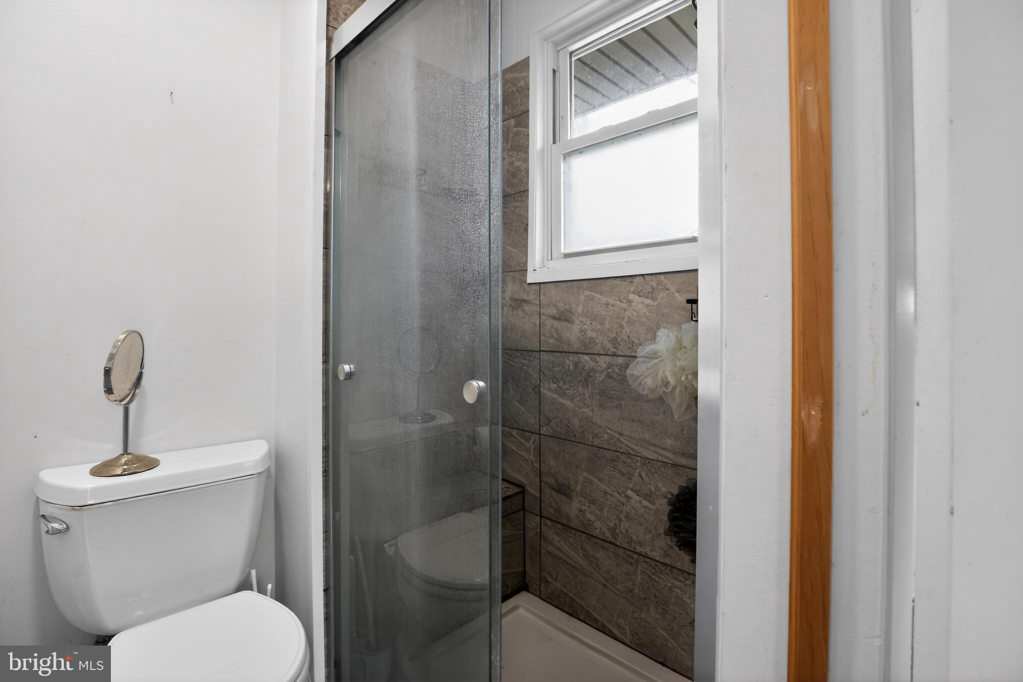 4144 Fox Trail Road Havre de Grace, MD 21078 - Photo 35 of 39 a bathroom with a toilet and a window