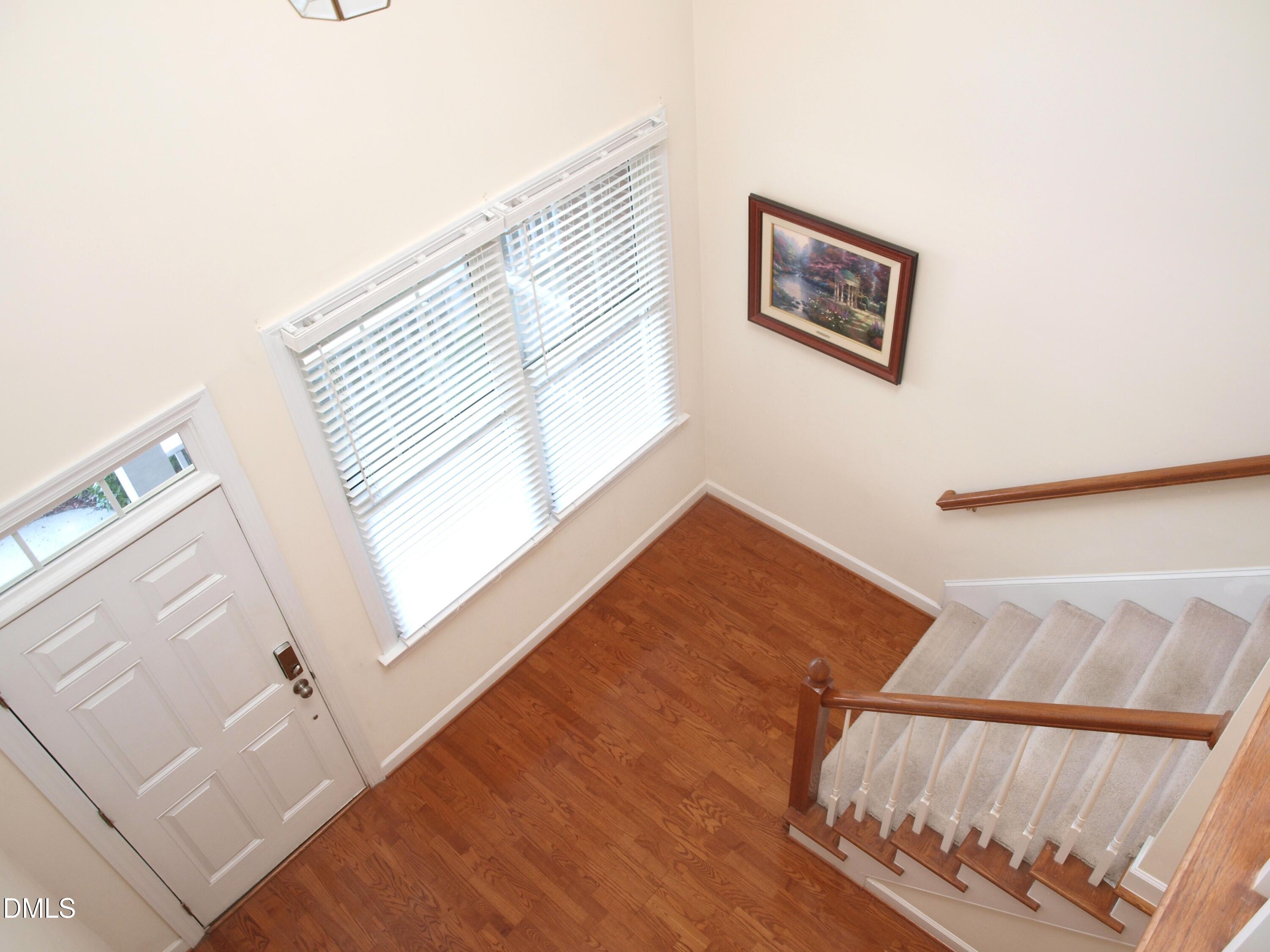 5206 Rio Grande Drive Raleigh, NC 27616 - Photo 6 of 37 a view of a bedroom with wooden floor and a rug