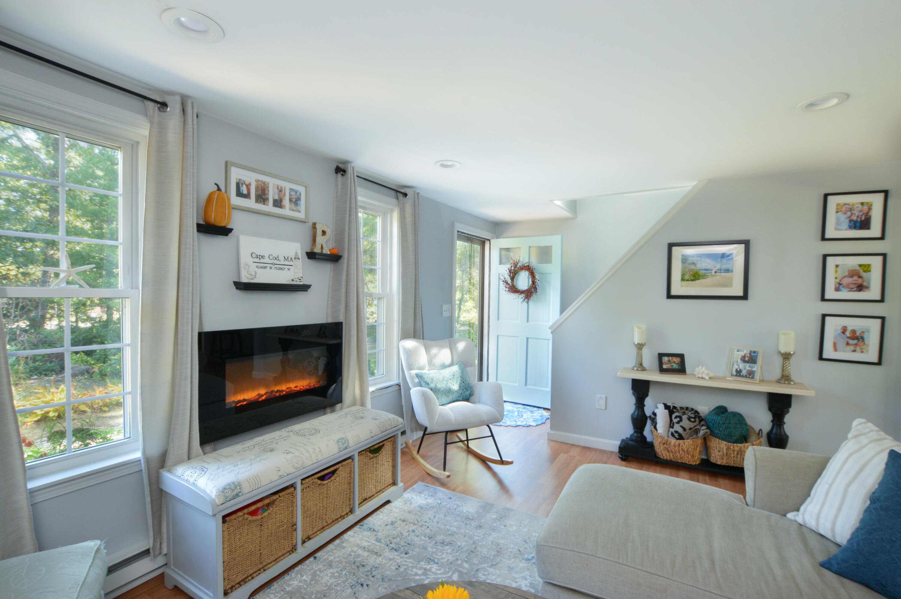 829 Pitcher's Way Hyannis, MA 02601 - Photo 11 of 32 a living room with furniture and a fireplace