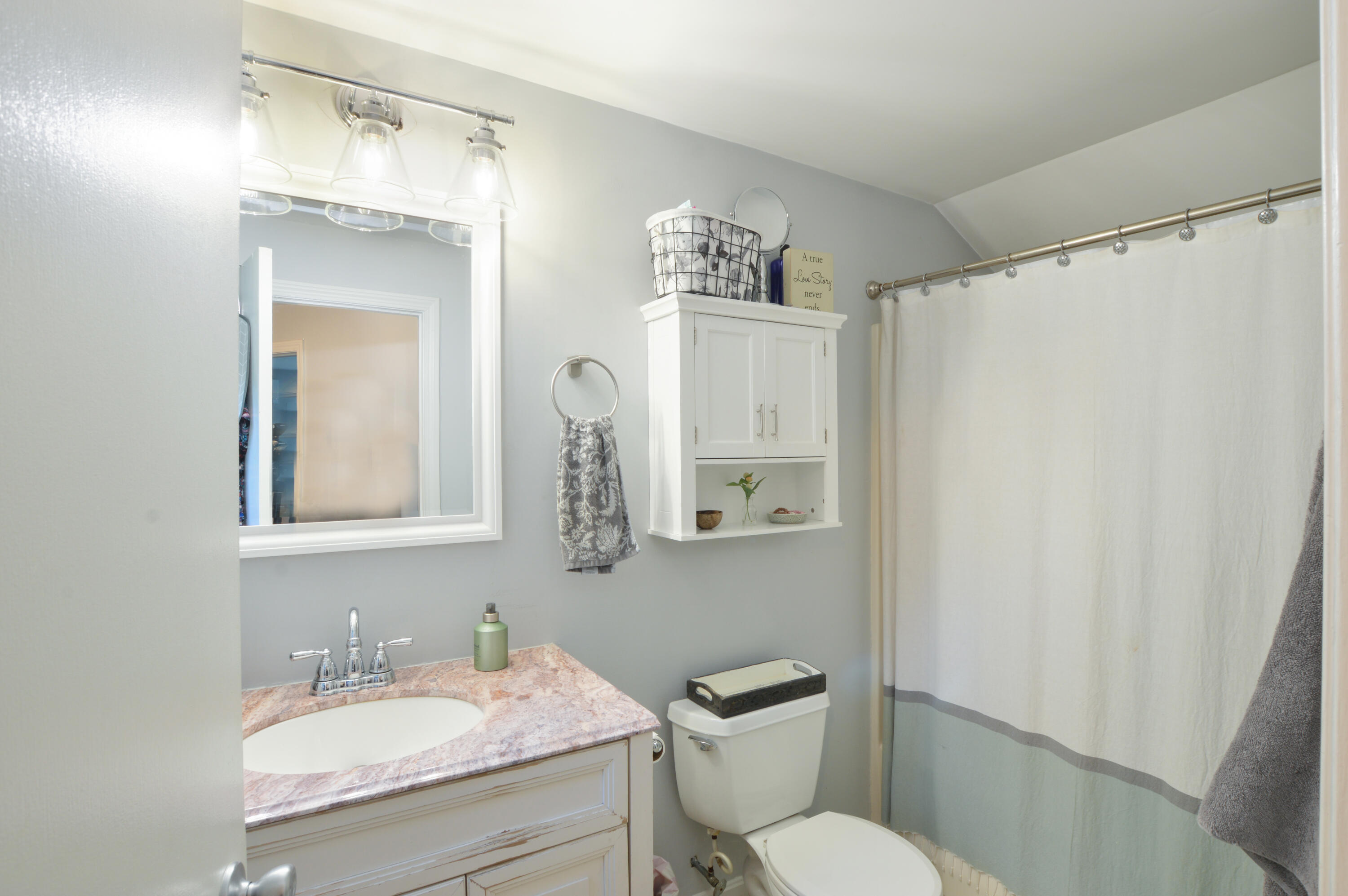 829 Pitcher's Way Hyannis, MA 02601 - Photo 18 of 32 a bathroom with a toilet sink and mirror