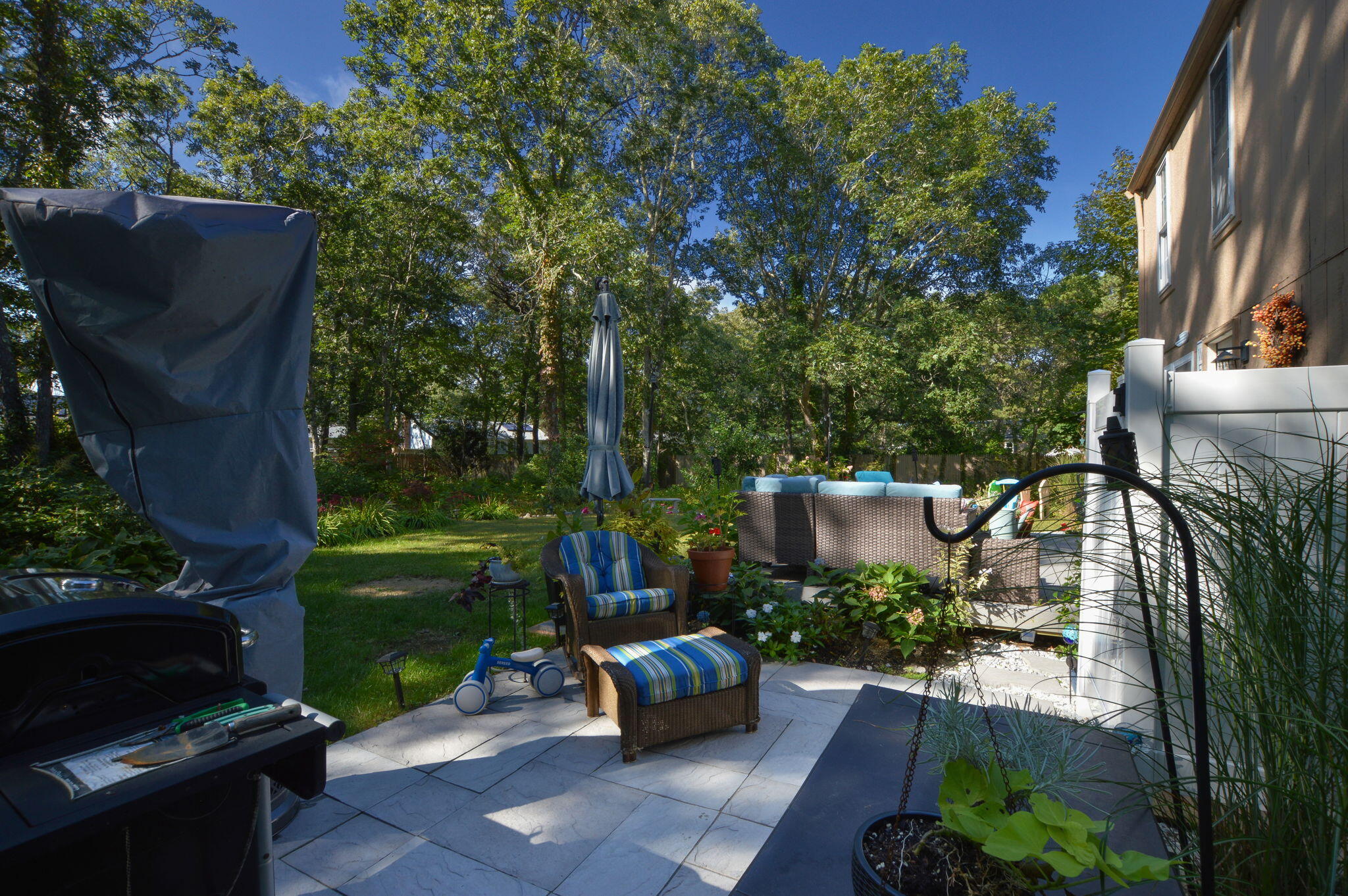 829 Pitcher's Way Hyannis, MA 02601 - Photo 20 of 32 a view of a patio with couches table and chairs and potted plants