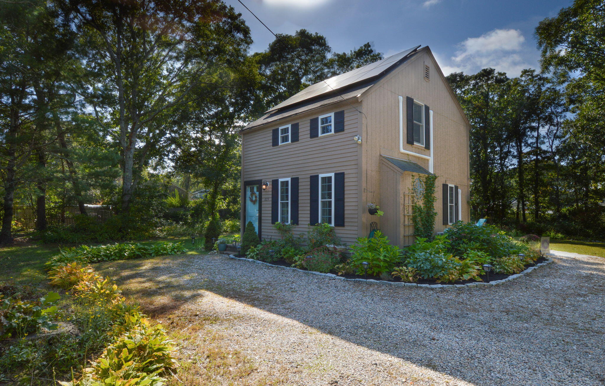 829 Pitcher's Way Hyannis, MA 02601 - Photo 2 of 32 a front view of a house with garden