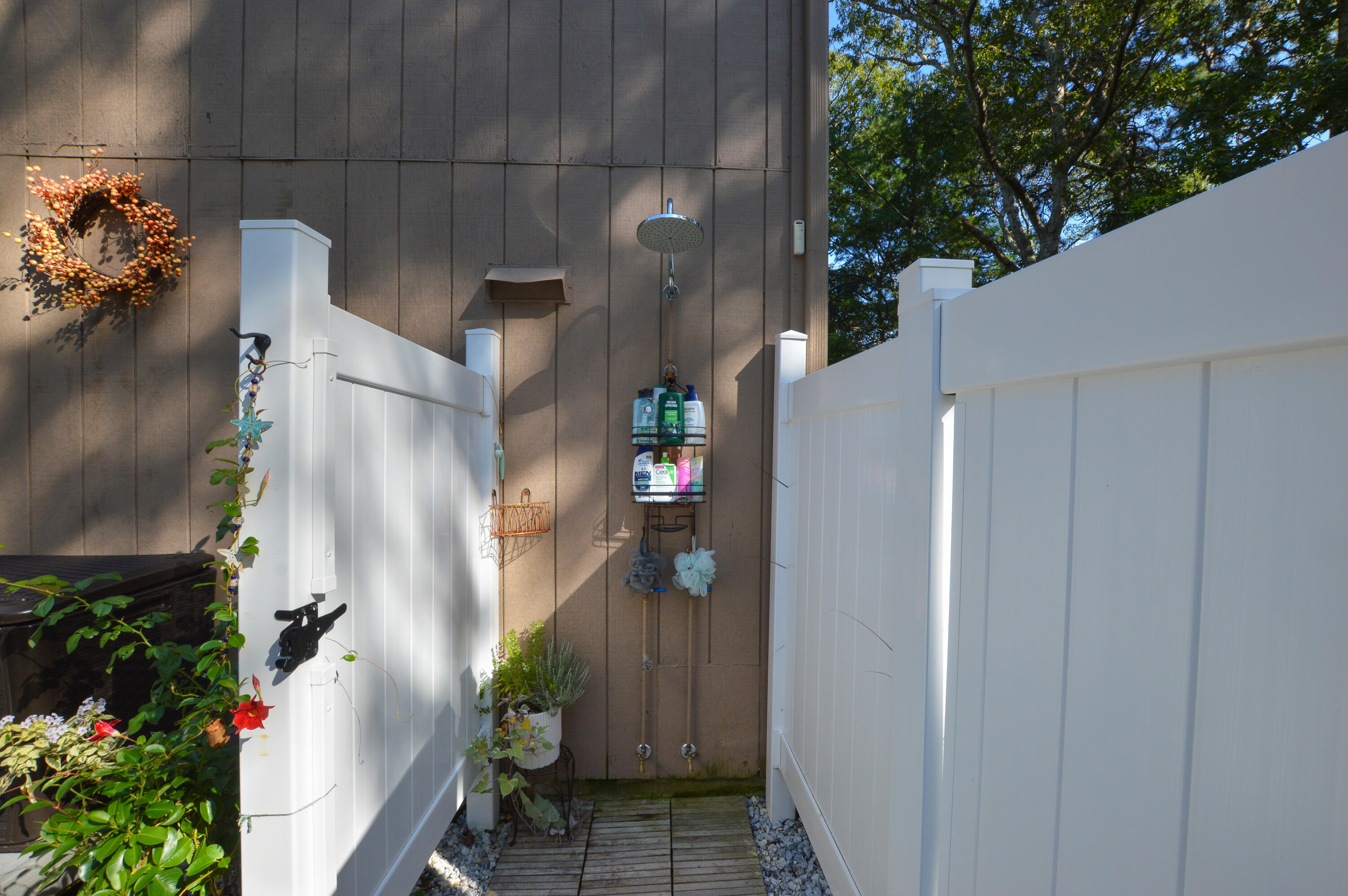 829 Pitcher's Way Hyannis, MA 02601 - Photo 21 of 32 a potted plant sitting in front of a house