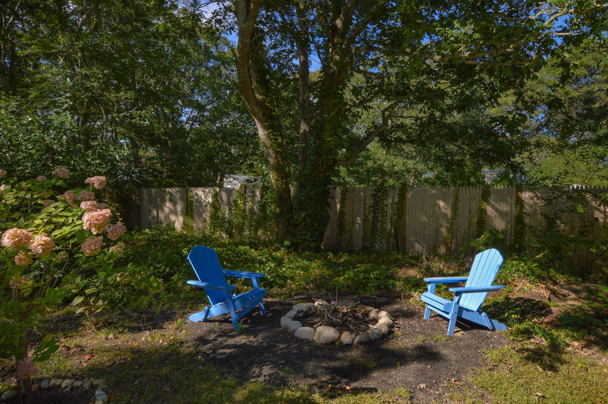 829 Pitcher's Way Hyannis, MA 02601 - Photo 22 of 32 a view of a bench in a backyard