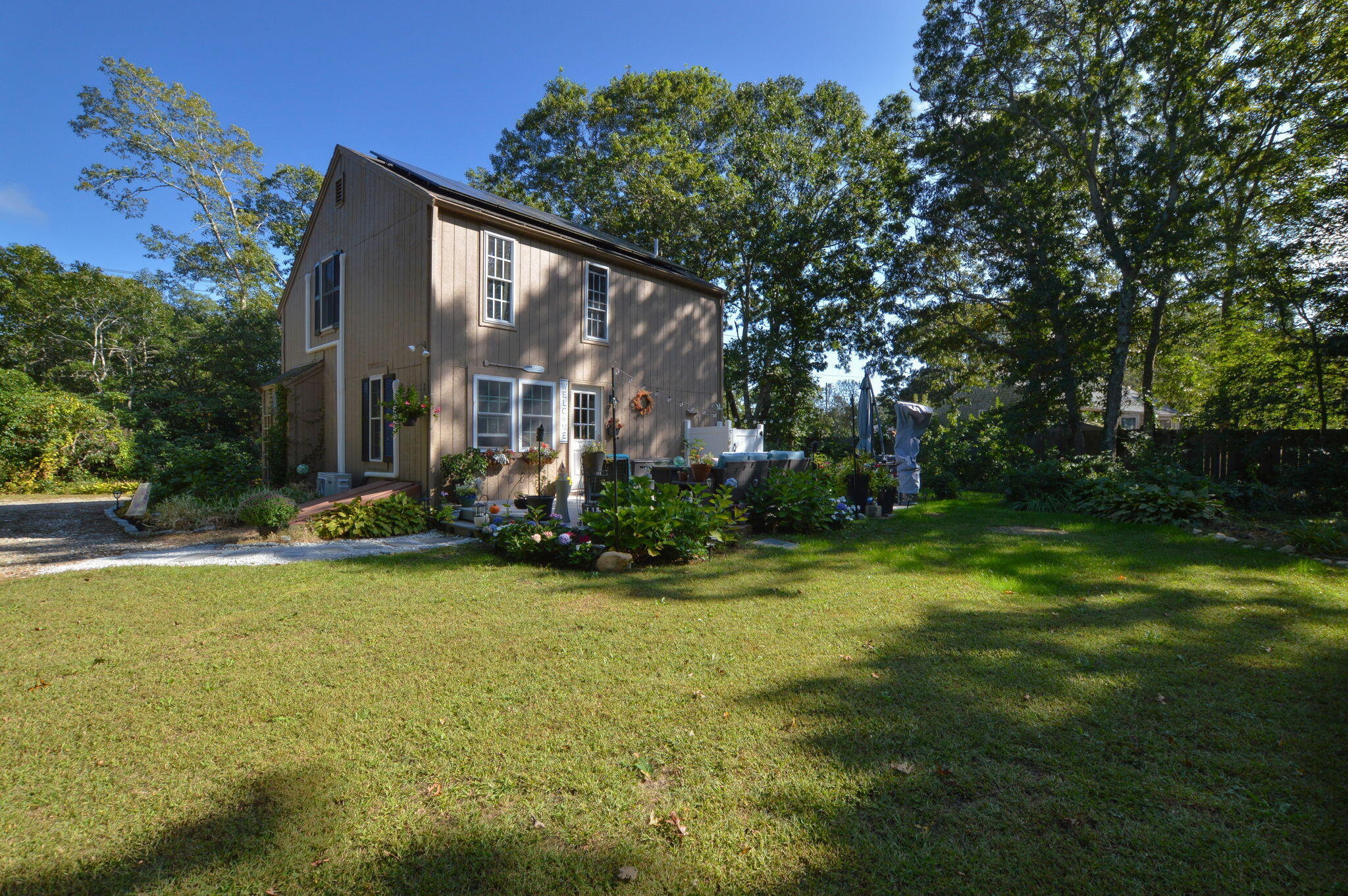 829 Pitcher's Way Hyannis, MA 02601 - Photo 24 of 32 a view of a house with a yard and basketball court