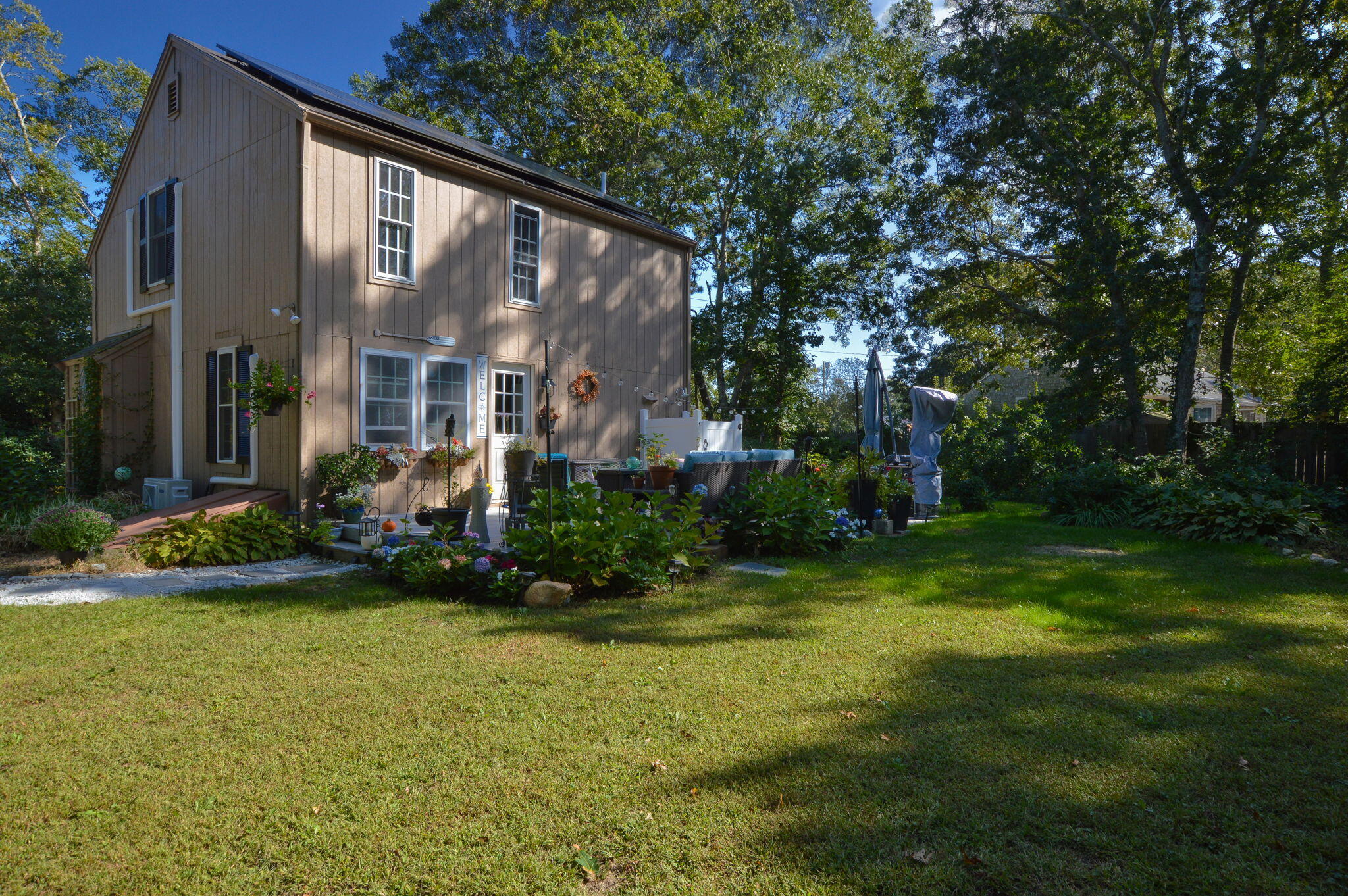829 Pitcher's Way Hyannis, MA 02601 - Photo 26 of 32 a view of a house with garden and sitting area