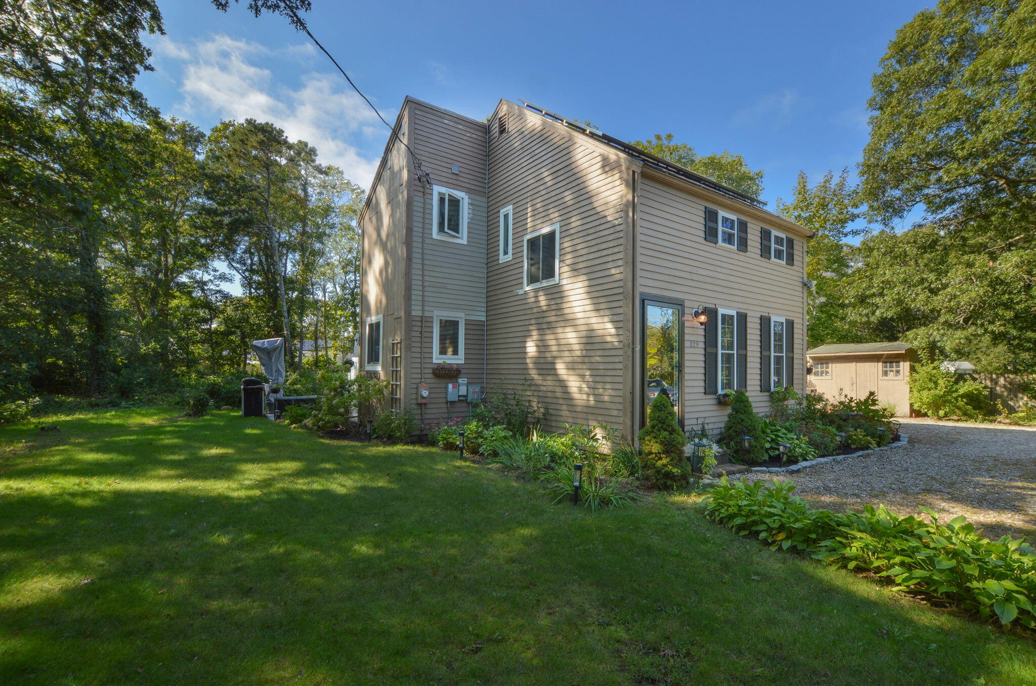 829 Pitcher's Way Hyannis, MA 02601 - Photo 27 of 32 a front view of a house with garden