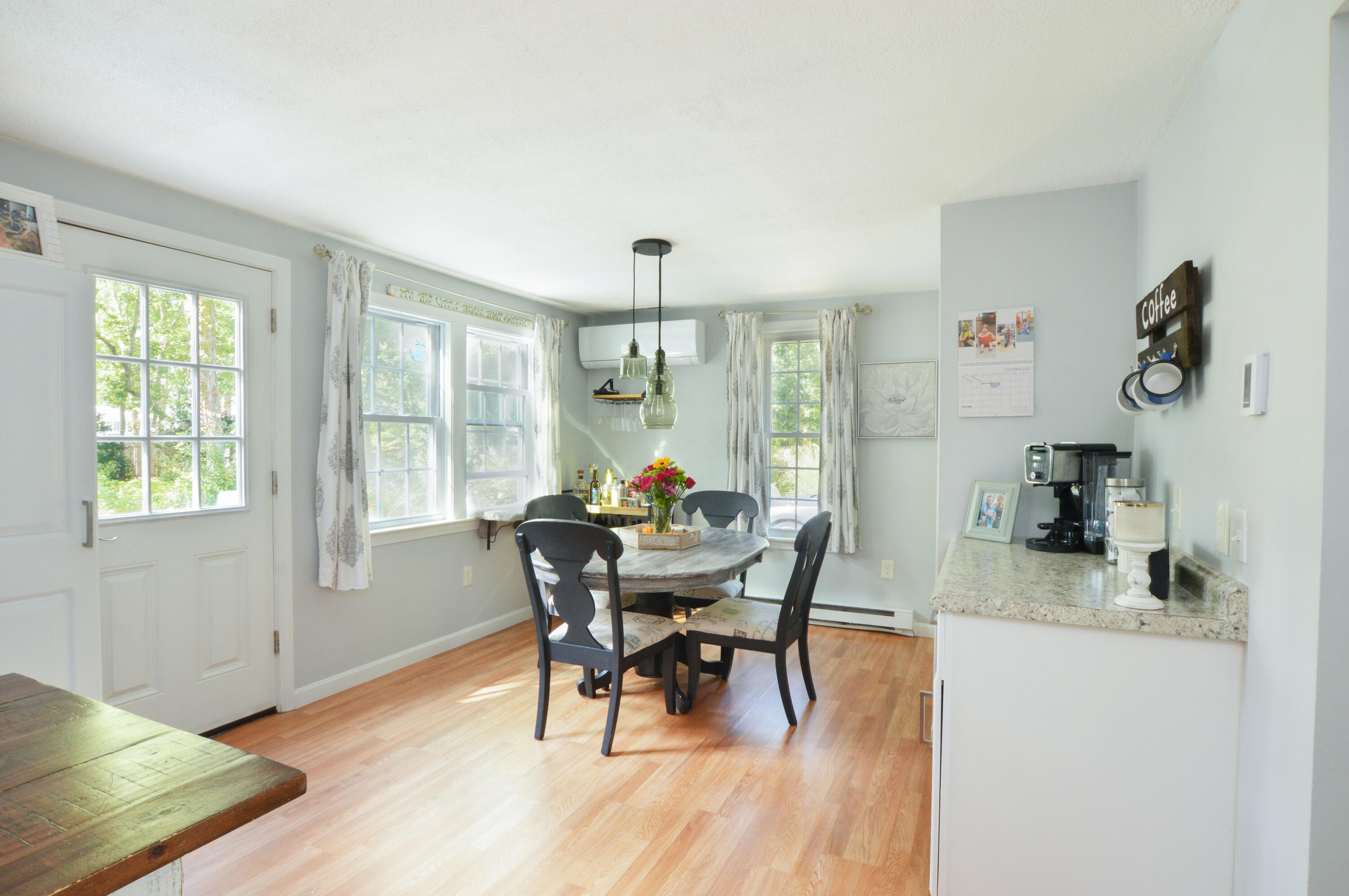 829 Pitcher's Way Hyannis, MA 02601 - Photo 7 of 32 a view of a dining room with furniture and wooden floor