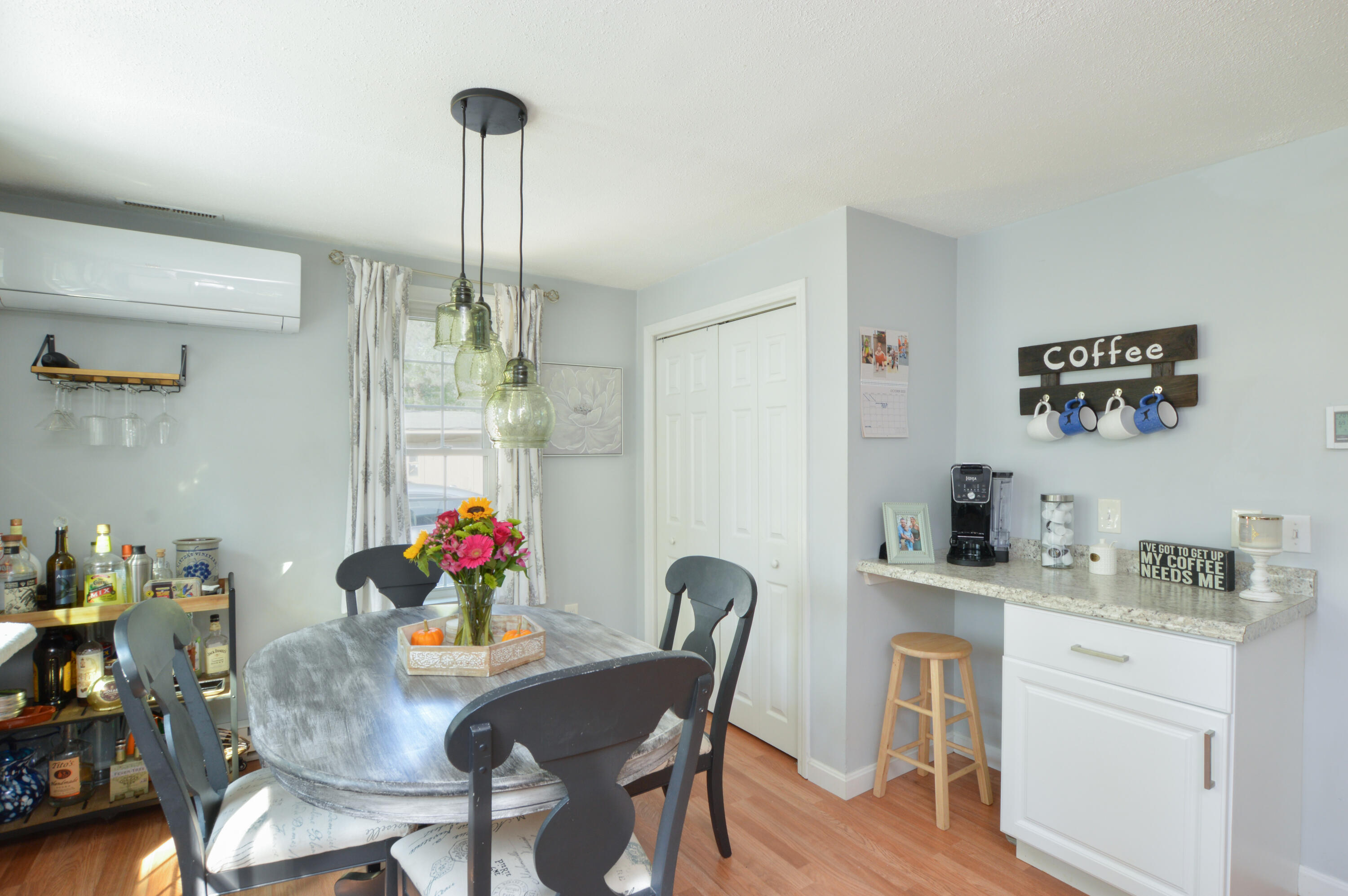 829 Pitcher's Way Hyannis, MA 02601 - Photo 8 of 32 a view of a dining room with furniture wooden floor and a chandelier