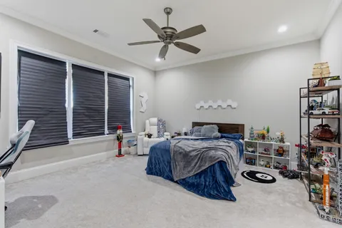 a bedroom with furniture and a window