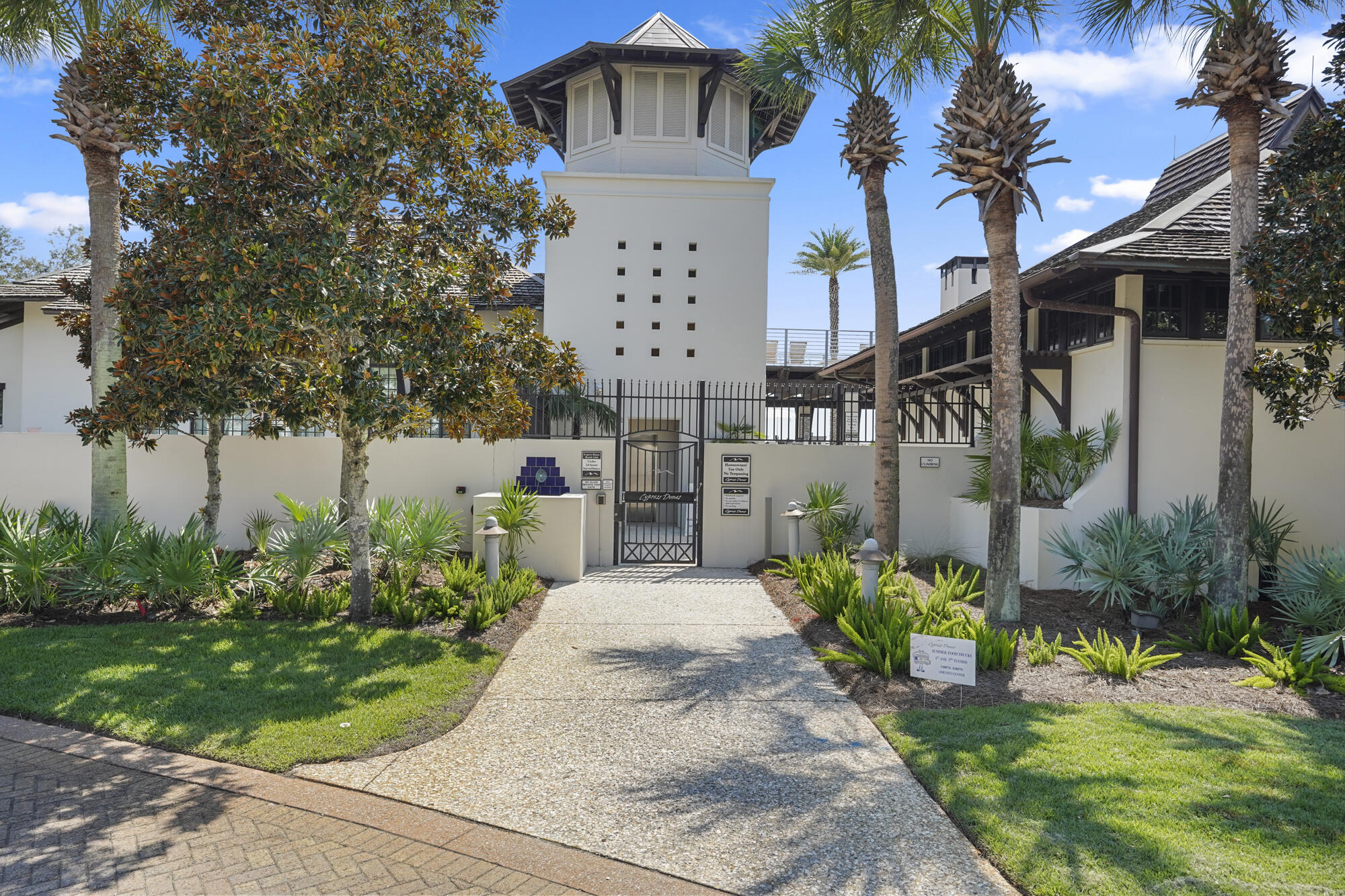 48 Cypress Walk Santa Rosa Beach, FL 32459 - Photo 13 of 17 a front view of a house with a garden