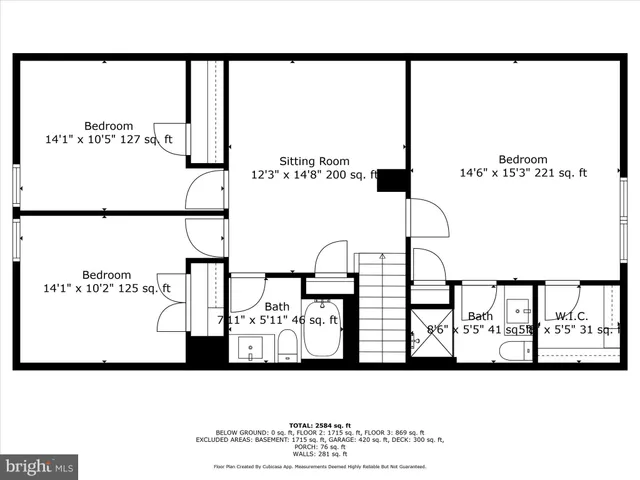 a white house sitting in middle of the grass