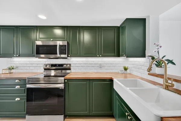 a kitchen with a sink and a microwave