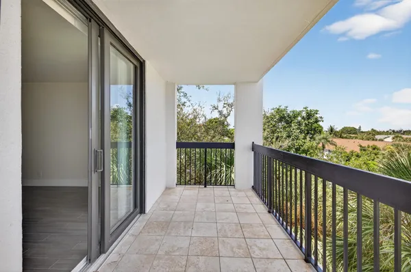 a view of a porch with wooden floor and outdoor space