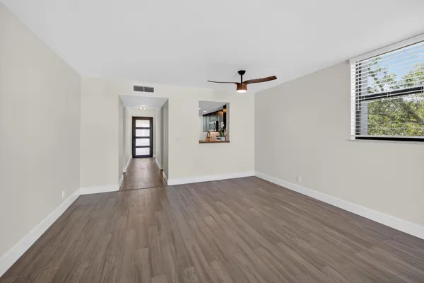 a view of a dining room with furniture and window