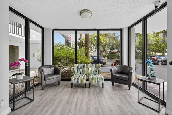 a view of a swimming pool with palm trees