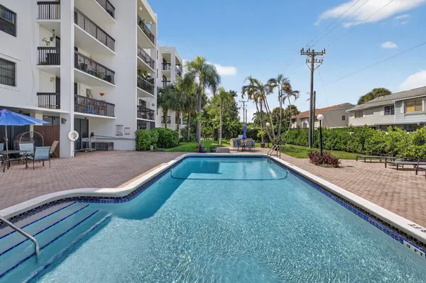 a view of a building with a yard