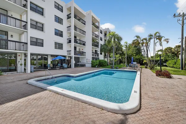 a view of a dining area with furniture and wooden floor