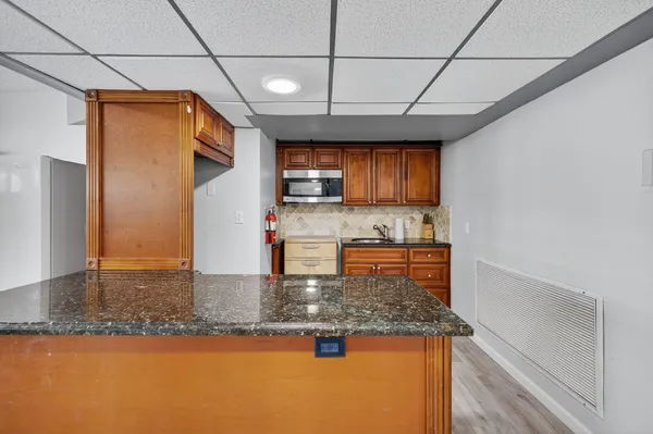 an aerial view of a house with a yard and garden