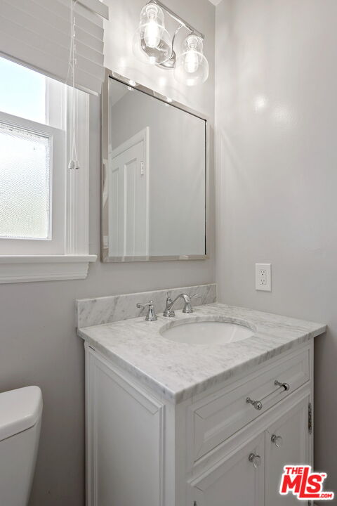 15415 Albright Street Pacific Palisades, CA 90272 - Photo 15 of 21 a bathroom with a sink and a mirror