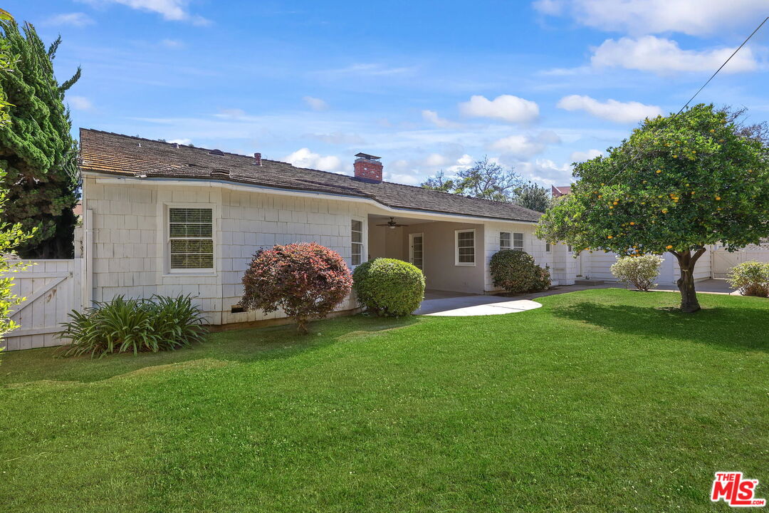 15415 Albright Street Pacific Palisades, CA 90272 - Photo 17 of 21 a view of a house with a backyard