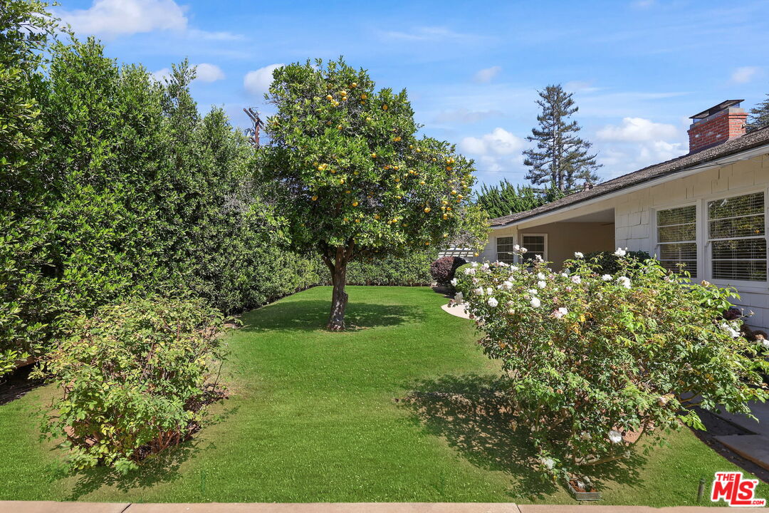 15415 Albright Street Pacific Palisades, CA 90272 - Photo 19 of 21 a front view of a house with garden