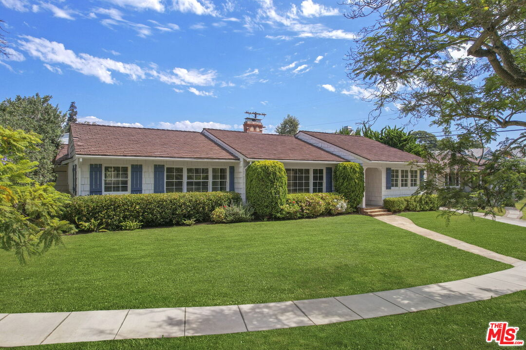 15415 Albright Street Pacific Palisades, CA 90272 - Photo 21 of 21 a front view of a house with a garden