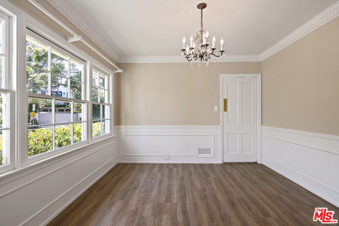 15415 Albright Street Pacific Palisades, CA 90272 - Photo 5 of 21 wooden floor in an empty room with a window