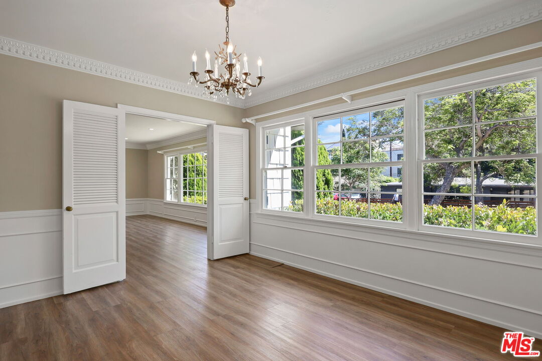 15415 Albright Street Pacific Palisades, CA 90272 - Photo 6 of 21 a view of an empty room with wooden floor and a window