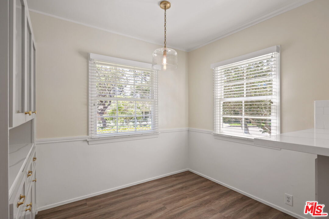 15415 Albright Street Pacific Palisades, CA 90272 - Photo 9 of 21 a view of an empty room with wooden floor and a window