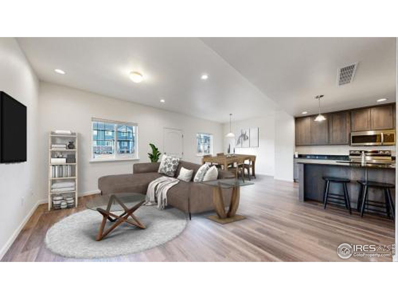 4355 24th Street Road, Unit 3202 Greeley, CO 80634 - Photo 3 of 33 Spacious Living Room with LVP Throughout the Main Level