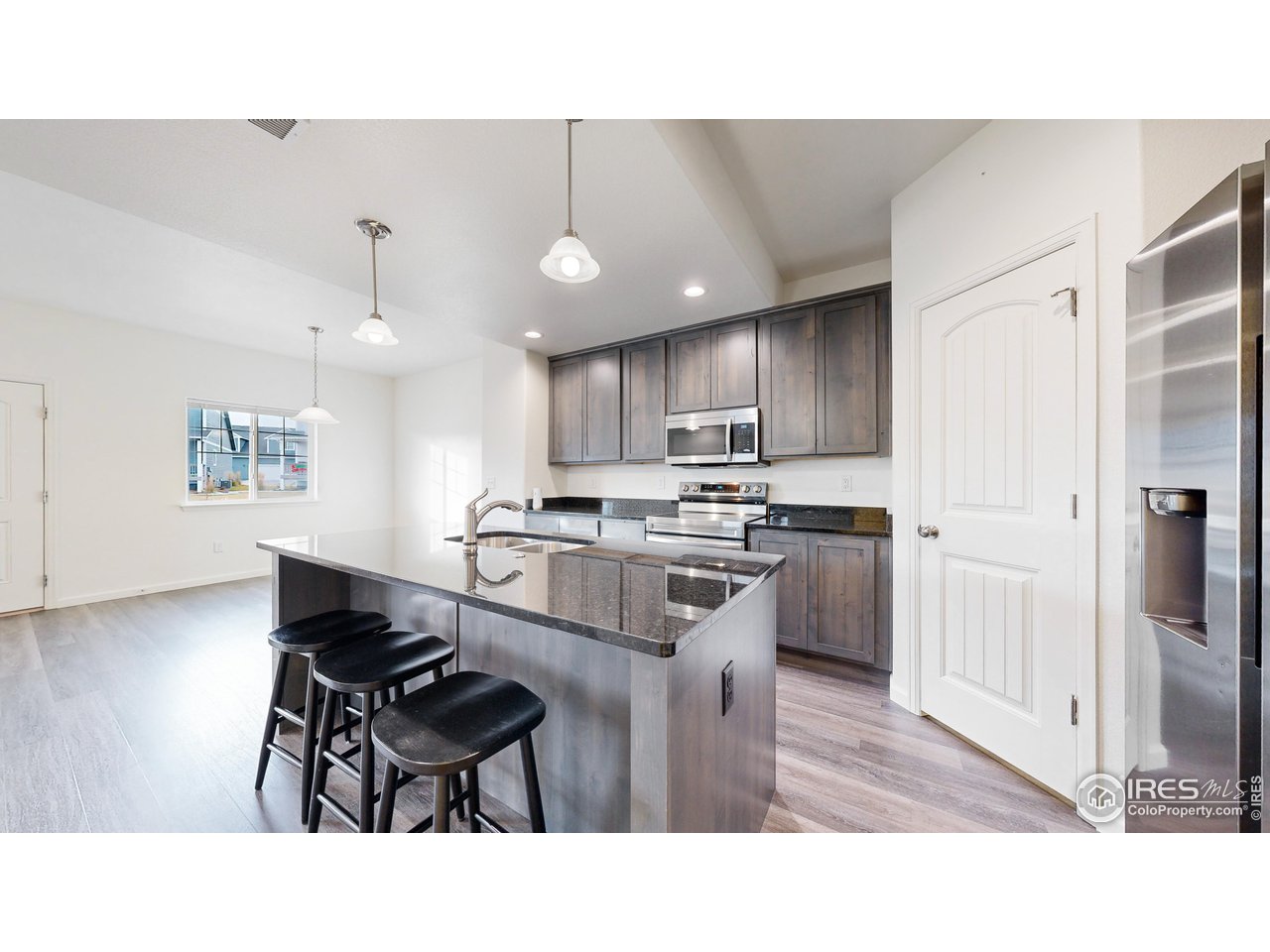 4355 24th Street Road, Unit 3202 Greeley, CO 80634 - Photo 10 of 33 Great Island with 3 Barstools