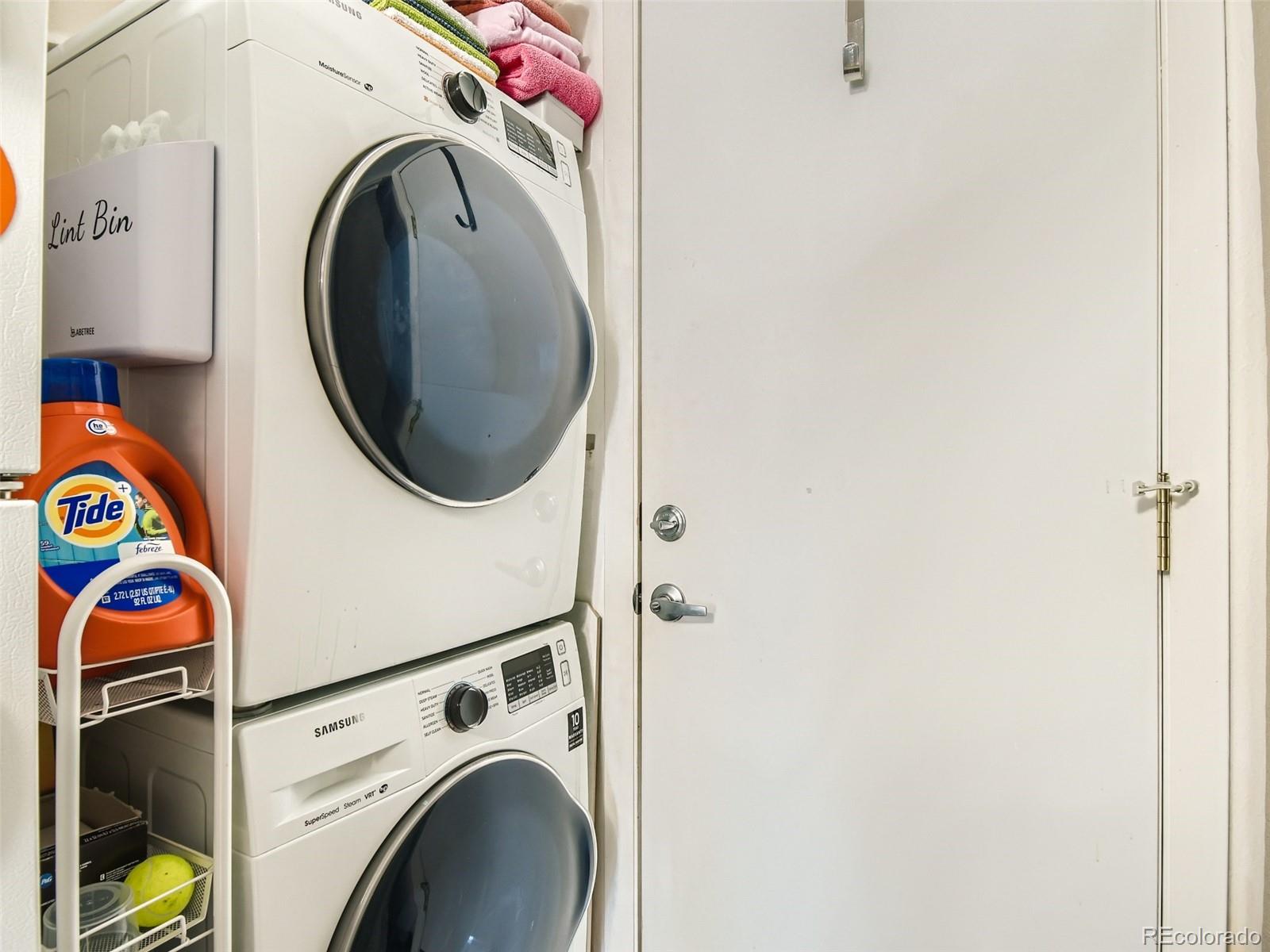 7994 Chase Circle, Unit 18 Arvada, CO 80003 - Photo 13 of 15 a utility room with dryer and washer