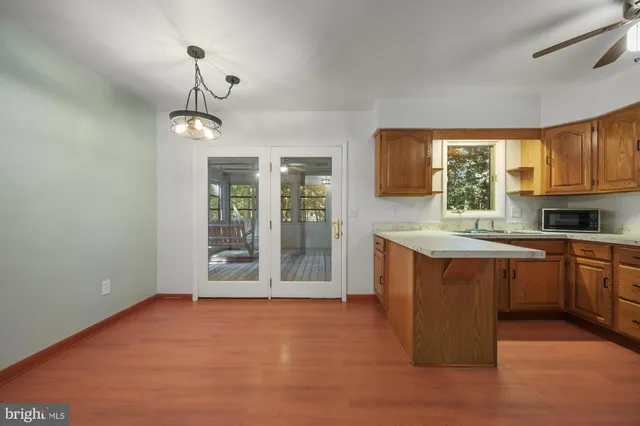 a kitchen with stainless steel appliances granite countertop a stove and cabinets