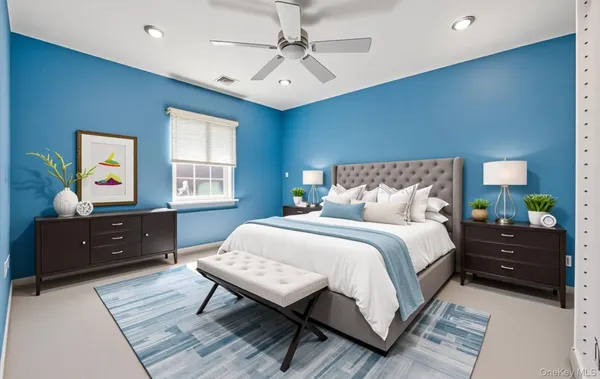 a bedroom with a bed and a dresser