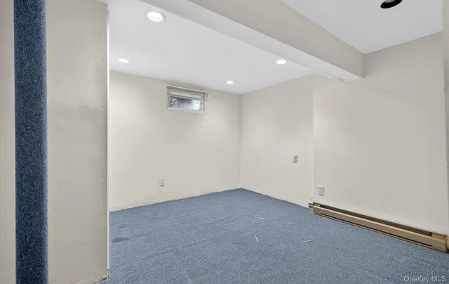 a bathroom with a sink toilet and a mirror