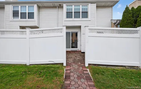 a street view with tall trees
