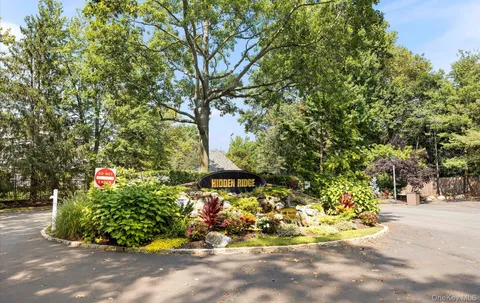 a view of a house with potted plants