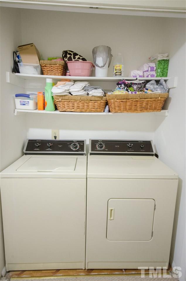 1245 Schaub Drive, Unit 1245 Raleigh, NC 27606 - Photo 10 of 10 a utility room with washer and dryer