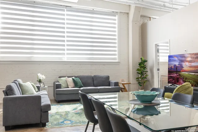 a dining room with furniture and window