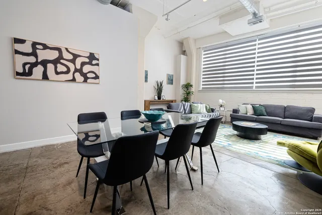 a table with chair and white wooden floor