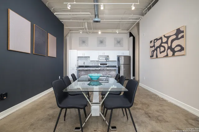 a kitchen with cabinets stainless steel appliances and a counter space