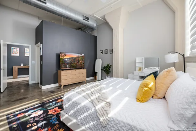 a bedroom with a bed and a dresser