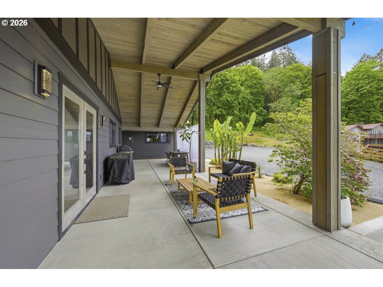 33192 Wilkins Road Eugene, OR 97408 - Photo 5 of 35 a view of a porch with chairs and backyard
