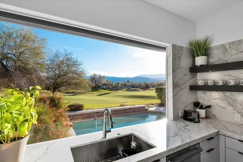 a workspace with furniture and a book shelf