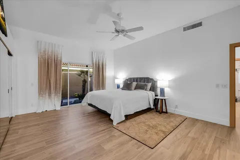 a en suite bathroom with double vanity sink a mirror and a shower