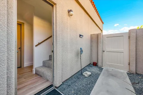 a bathroom with a granite countertop sink toilet a large mirror a shower and vanity