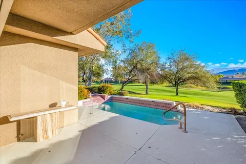 a aerial view of a house with swimming pool
