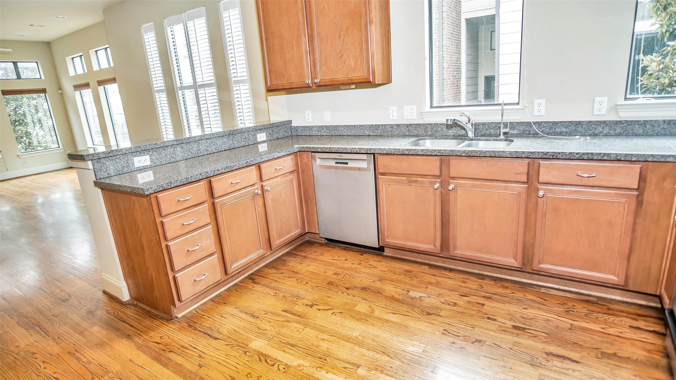 1611 Silver Street Houston, TX 77007 - Photo 7 of 32 a view of a kitchen with granite countertop cabinets and a sink